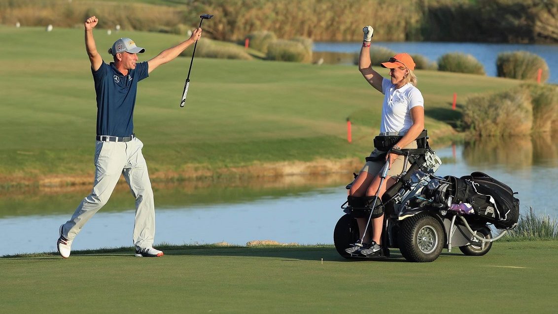 Disability Golfer in adaptive buggy with Marcel Siem